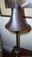 Full view of lamp with damaged shade