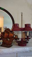 Lamp and ship bookend on mantle