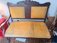 Front view of Victorian settee showing full frame and upholstery