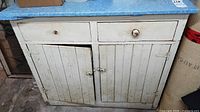 Front view showing entire cabinet, drawers, doors, laminate top