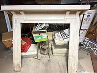 Front view of full mantel surround showing overall structure and distress