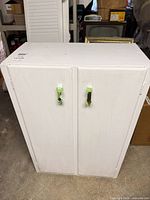 Front view of white two-door cabinet