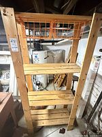 Front view of wooden shelving unit with two orange baskets