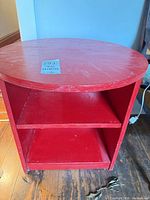 Front view showing shelves and red finish