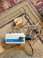 Front/side view of Elmo camera body, yellow inline module and cable
