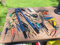 overview of assorted hand tools spread on table