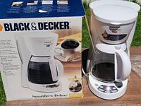 Coffee maker displayed beside original SmartBrew Deluxe box