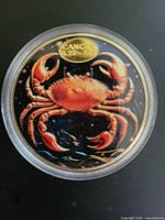 obverse showing enamel crab design and Cancer label