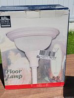 Front of box showing Home Styles floor lamp image