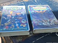 Front covers of both Digimon VHS tapes showing titles and artwork