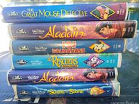 Stack of six Disney Black Diamond VHS tapes showing spines and titles