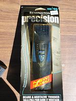Front view of sealed Remington Precision MB-10 trimmer in retail package