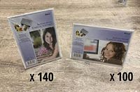 Sealed vertical and horizontal Sabre acrylic frame packages with quantity text overlays