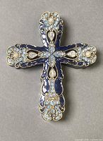 Front view showing blue enamel, rhinestones, gold trim