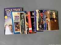 All 11 books side by side spines and covers