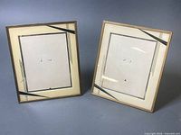Two gold-tone Art Deco photo frames front view