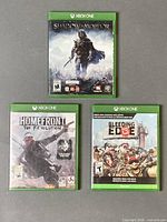 Front view of all three Xbox One game cases