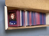 Open box showing stacked Star Trek trading cards