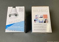Two product boxes labelled Music Smart Colorful Bulb