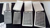 Four ALPHA controllers with ribbon cable and styrofoam trays
