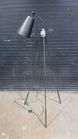 Full view of tripod bronze metal floor lamp