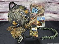 All items overview: gloves, wind panels package, Yaktrax box, bungee tether, round cushion