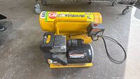 Side view showing yellow twin tanks, CH Extreme branding, black motor, power cord