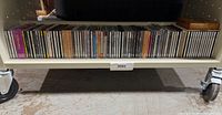 Entire bottom shelf showing full span of CD collection