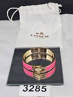 Bracelet on display with Coach dust bag