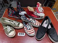 Overview of all five sneaker pairs on table