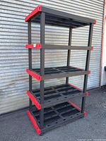 Full view of shelving unit showing all five shelves and color scheme