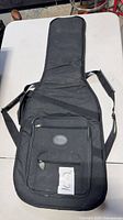 Full frontal view of black Fender gig bag showing overall design and size