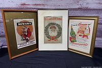 Group view of all three framed Santa Claus advertisement prints