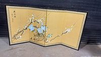 Full view of unfolded four-panel screen showing artwork and border