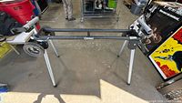 Full view of stand fully opened showing legs, main beam and mounting brackets