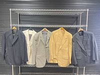Front view of all five jackets on rack