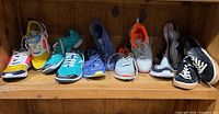 All six pairs lined on shelf showing overall condition and colors