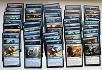 Spread of face-up cards showing variety of blue, black, white and green Core Set 2019 and mixed set cards