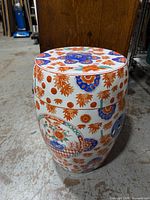 Full view of porcelain garden stool showing overall condition and decoration