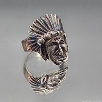 Front view of ring showing Indigenous American chief head design and patina
