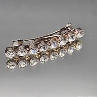 Side view showing rhinestones and clasp mechanism