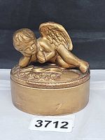 Gold round cherub trinket box front view