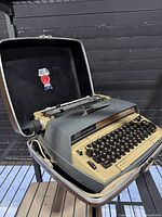 Typewriter inside open hard case