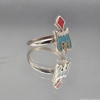 front and side view of ring showing turquoise and coral inlay design