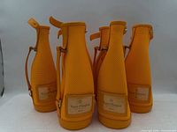 Front view of five coolers showing labels and overall shape