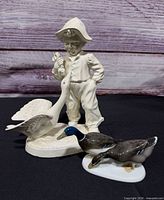 Group shot of both figurines: Rosenthal mallard ducks and Holland Mold boy with goose