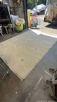 Full view of the rug laid flat showing size, pattern, overall condition