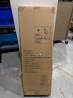 Full view of the sealed cardboard box containing the chair