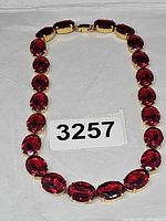 Front view showing full strand of red rhinestones and clasp