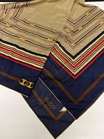 Full view of Gucci cotton scarf showing pattern and colours